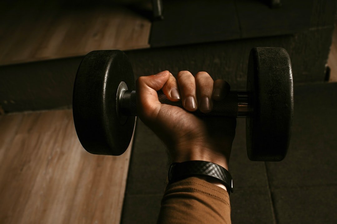 a-person-lifting-a-barbell-in-a-gym-dfv1vniqiqu